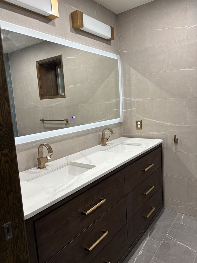 Double vanity with brass fixtures