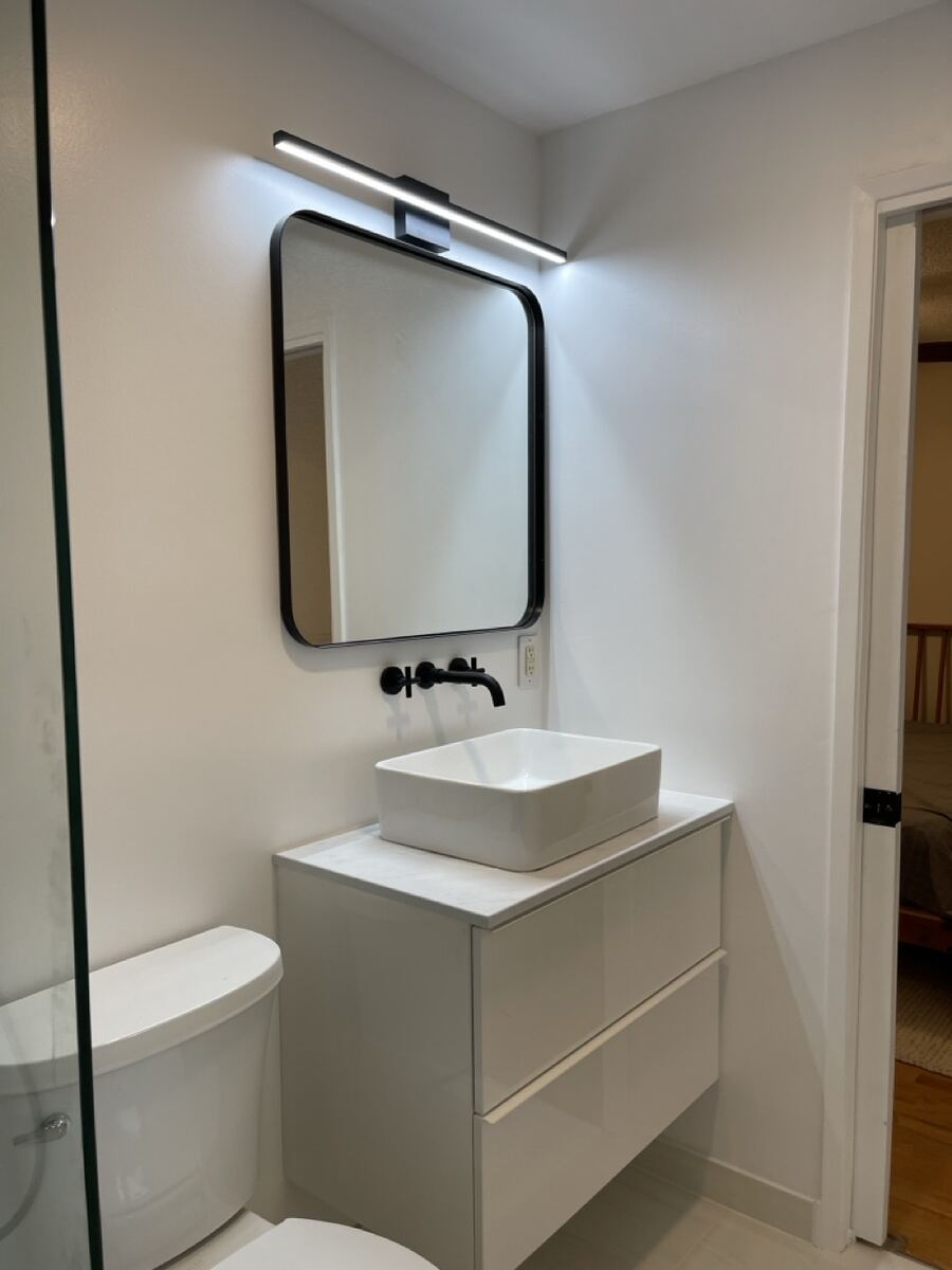 Floating vanity with a vessel sink
