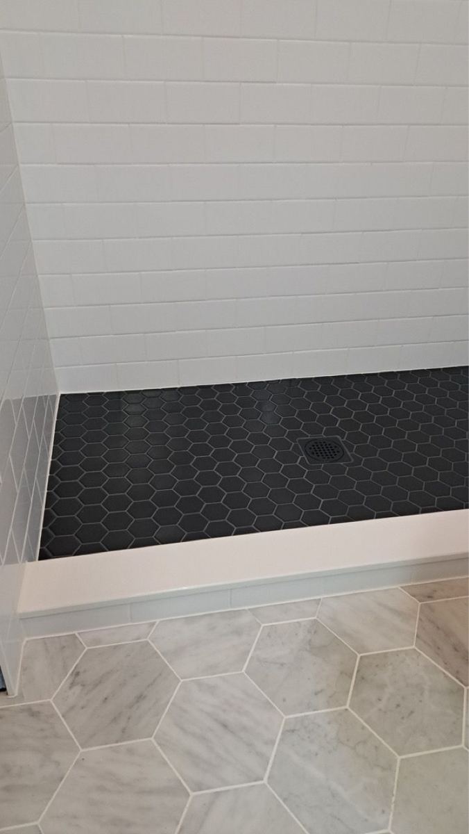 Black mosaic shower floor