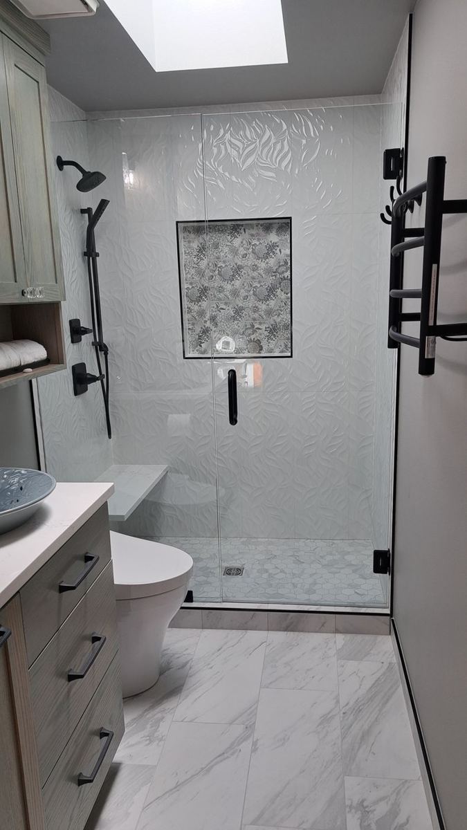 Bathroom with skylight and glass shower