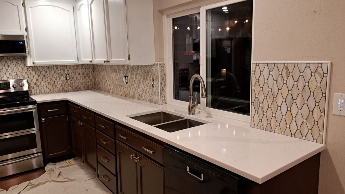 Dark cabinets with white quartz counters