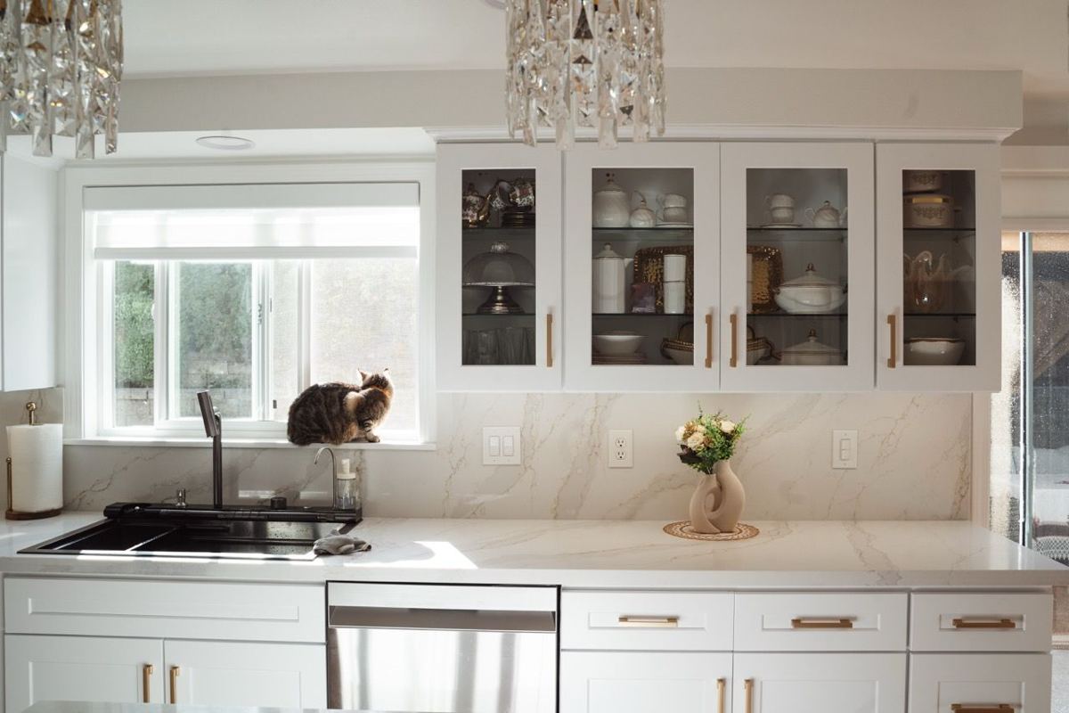 White kitchen with glass-front cabinets