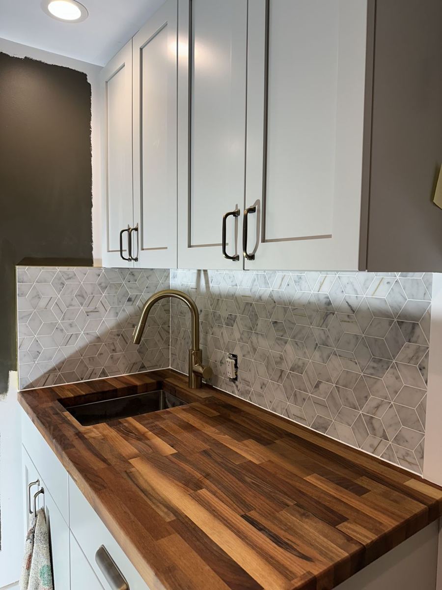 Butcher block counter with tile backsplash
